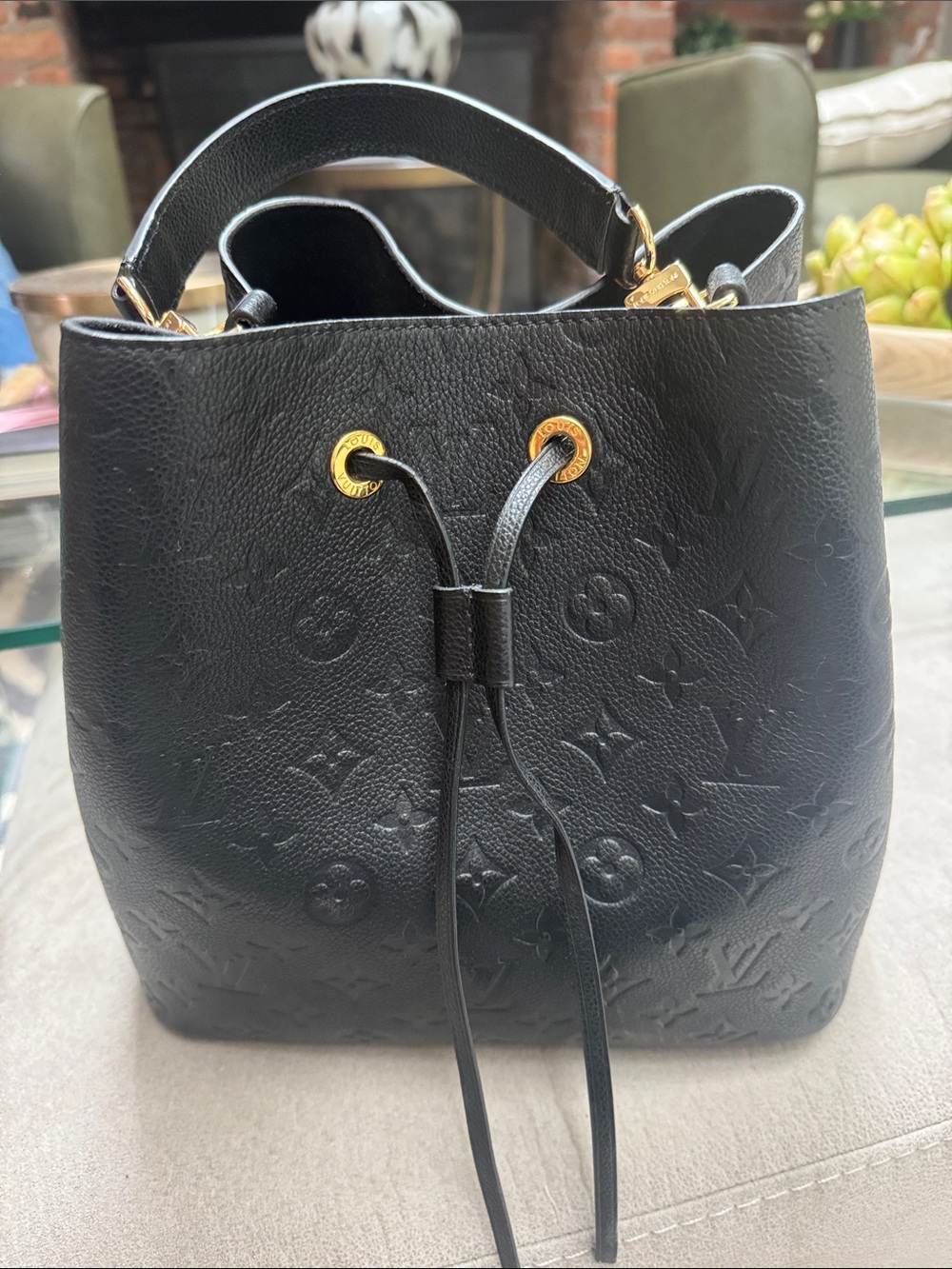 Black Embossed Leather Drawstring Satchel with Gold Accents